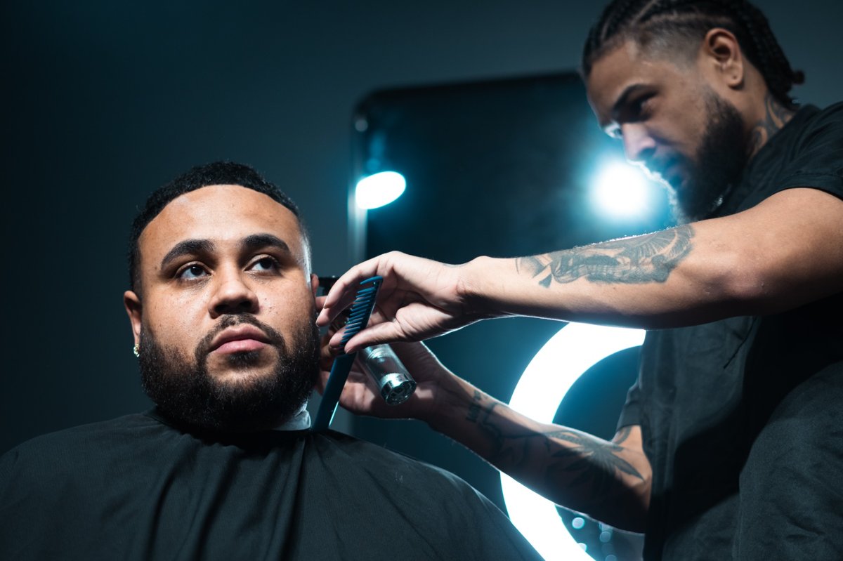 Justin cutting a client at Winners Circle Barbershop — South Austin